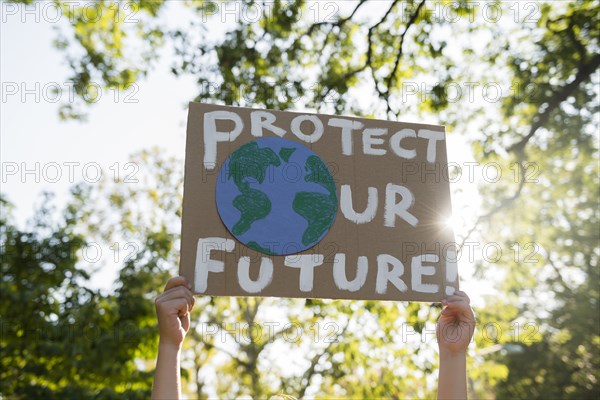 Climate change activist holding sign