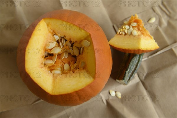 Carved pumpkin on brown paper