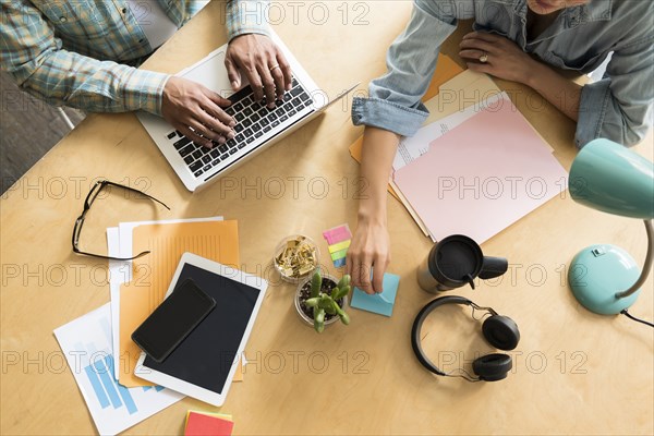 Coworkers working at office desk