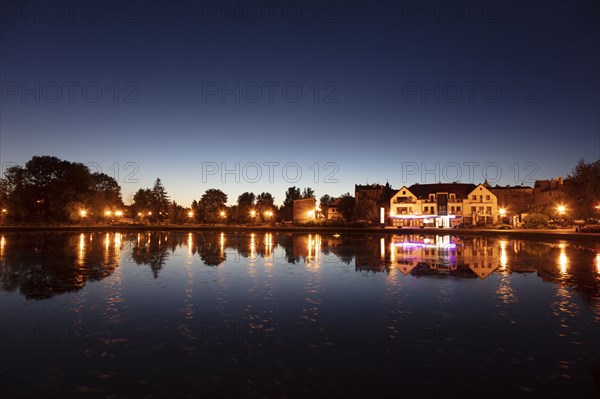 Lake and street lights at sunset in Mragowo, Warmian-Masurian, Poland