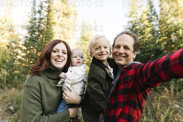 Family selfie in forest