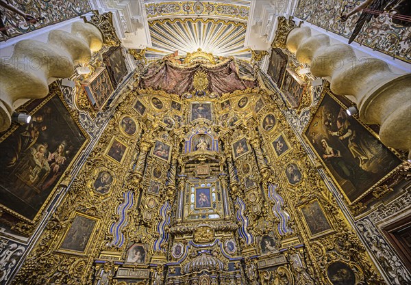 Ornate alter in Church of Saint Louis of France in Seville, Andalusia, Spain