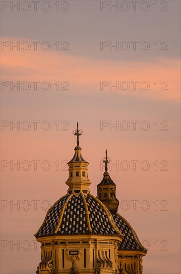 Domes of Church of Saint Louis of France at sunset in Seville, Andalusia, Spain
