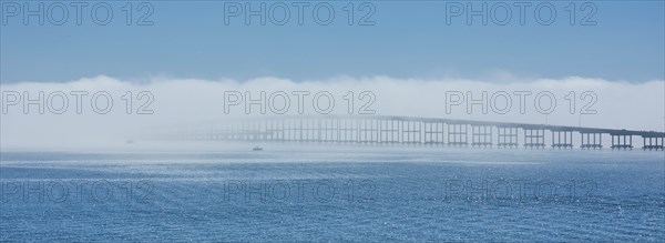 Bridge over sea in fog in Key Biscayne, Florida, USA