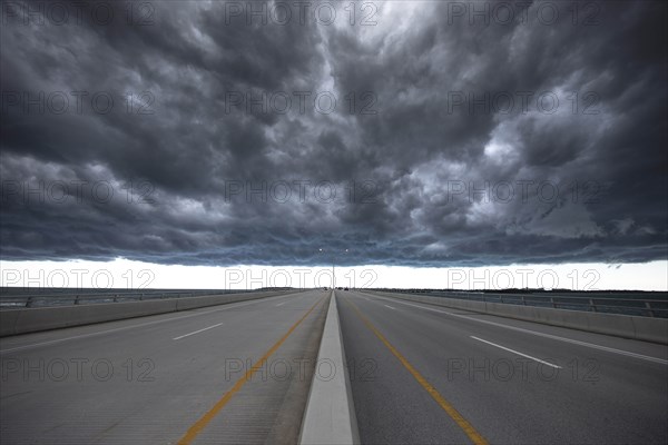 Road under stormy sky