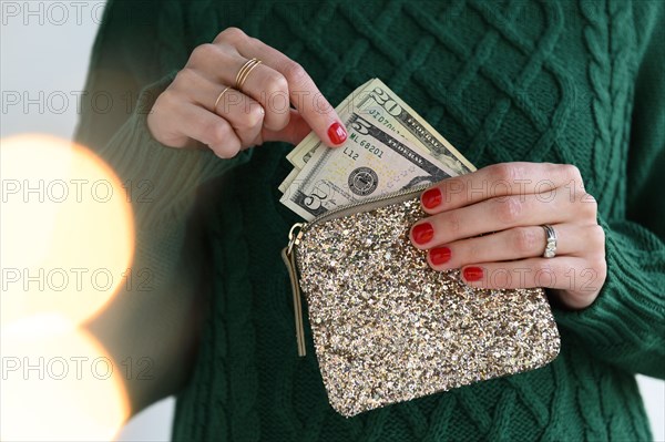 Woman holding purse with money