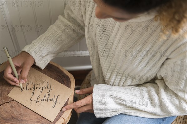 Woman writing on card