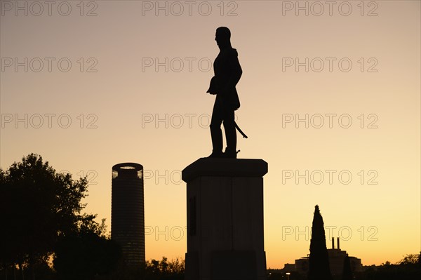 Silhouette of statue at sunset in Seville, Spain