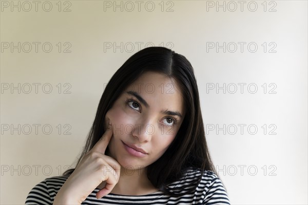 Bored woman touching her face