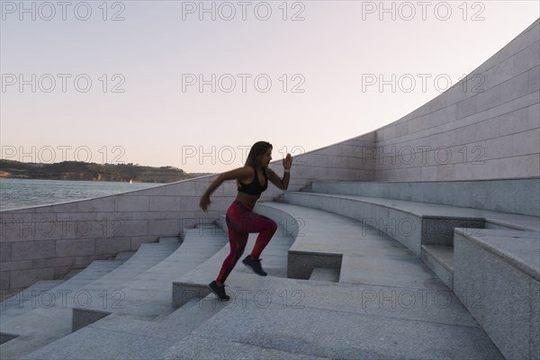 Woman running up steps