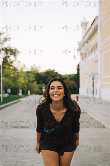 Smiling woman on footpath