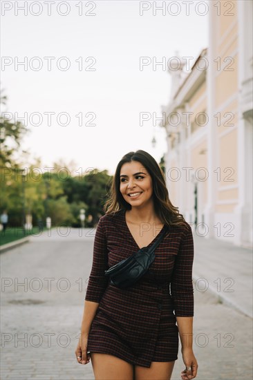 Smiling woman on footpath