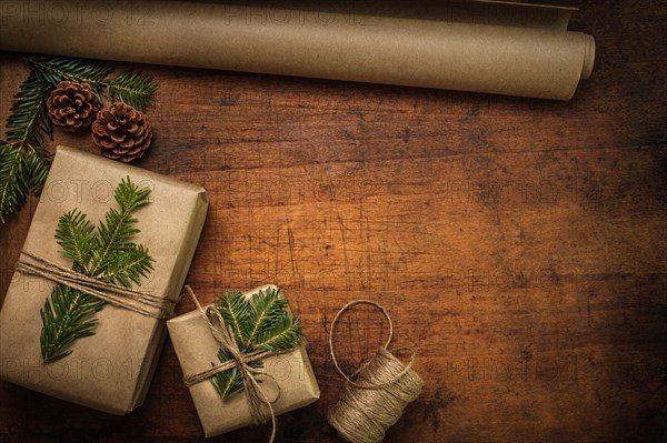 Pine fronds tied to Christmas presents