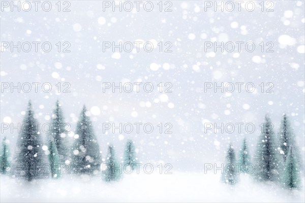 Snow falling on Christmas tree ornaments