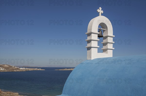 Bell tower by sea in Mykonos, Greece