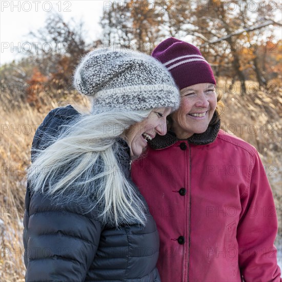 Smiling women wearing winter clothing