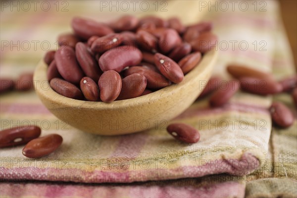 Kidney beans on wooden spoon