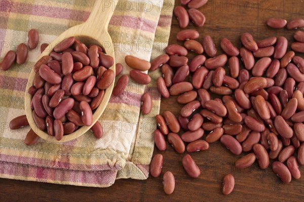 Kidney beans on wooden spoon