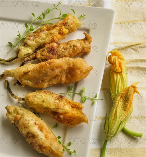 Fried zucchini blossoms with oregano