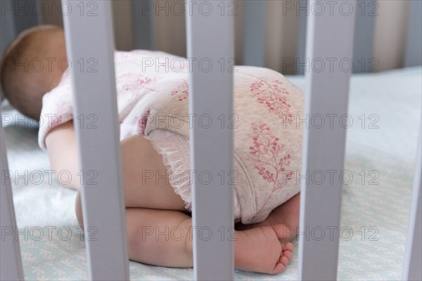 Baby sleeping in crib