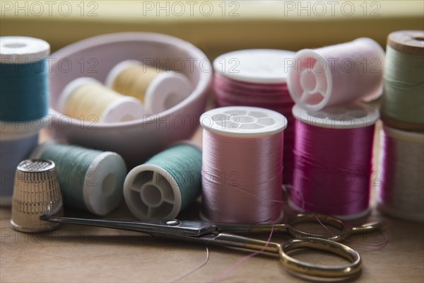 Variety of thread on spools and scissors