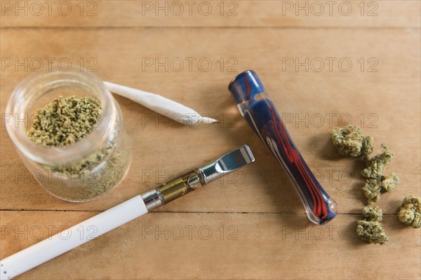 Marijuana products on wooden table