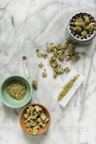 Marijuana with bowl, grinder, and rolling paper