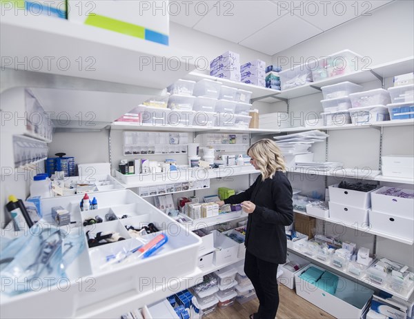 Dentist's assistant in storage room