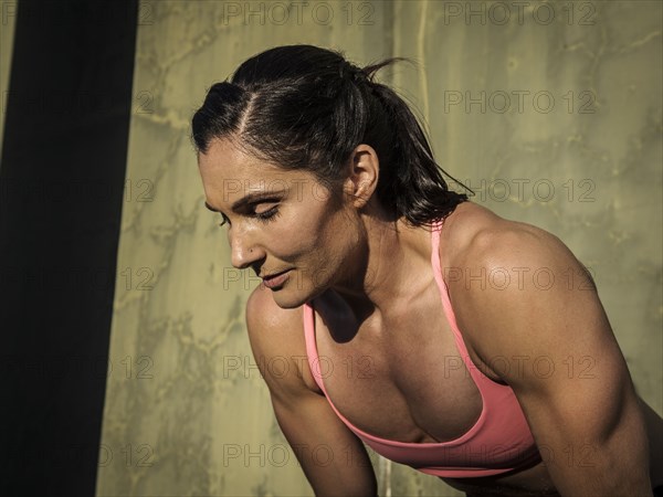 Woman resting during exercise