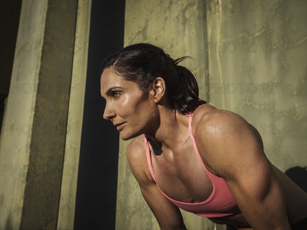 Woman resting during exercise