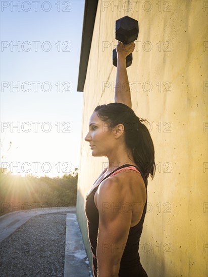 Woman weightlifting with dumbbells