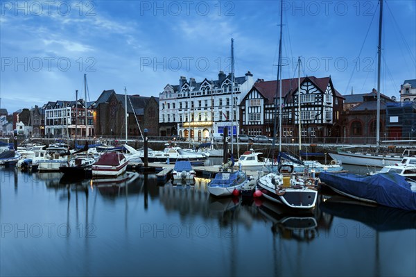 Boats moored on waterfront of Douglas, Isle of Man