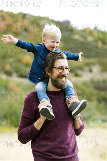 Father giving son piggyback ride