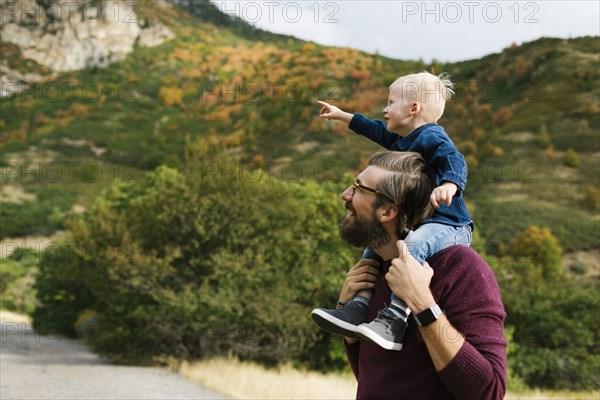 Father giving son piggyback ride