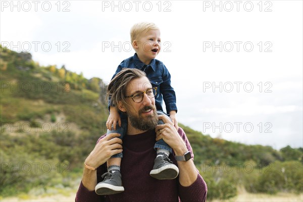 Father giving son piggyback ride