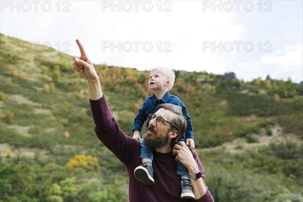 Father giving son piggyback ride