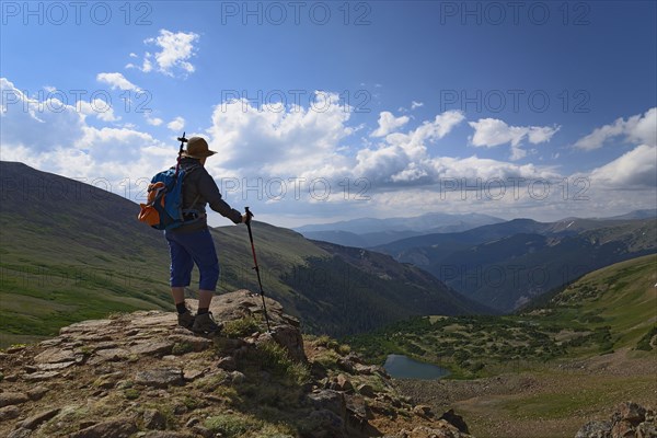 Woman admiring view while hiking on Berthoud Pass Trail in Colorado