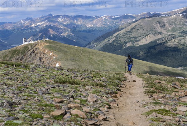 Woman hiking trail on Berthoud Pass Trail in Colorado