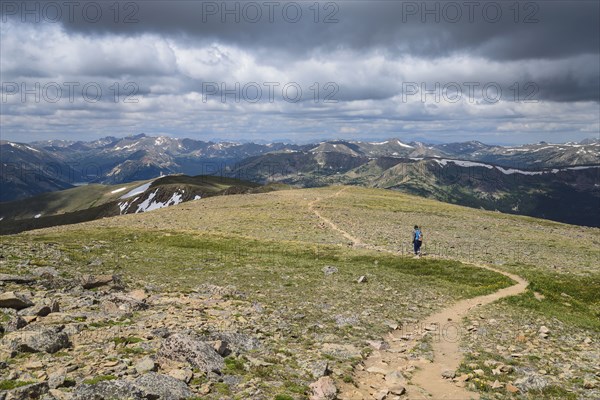 Woman hiking trail on Berthoud Pass Trail in Colorado