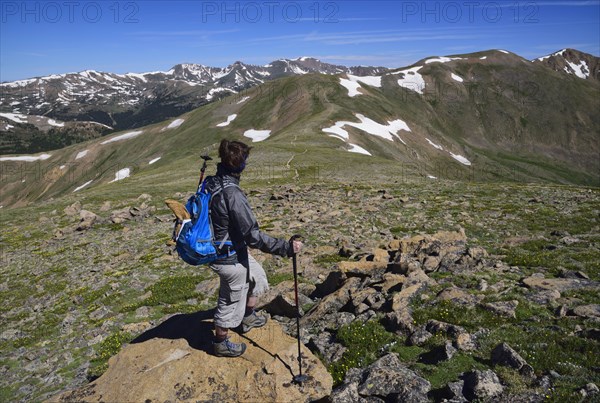 Woman looking at view while hiking in Loveland Pass, Colorado