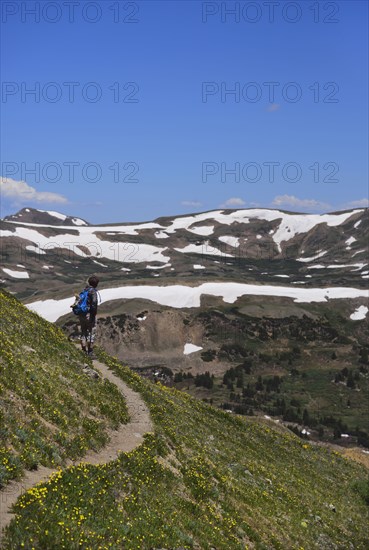Woman looking at view while hiking on Loveland Pass, Colorado