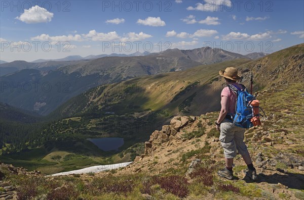 Woman looking at view while hiking on Mount Flora, Colorado