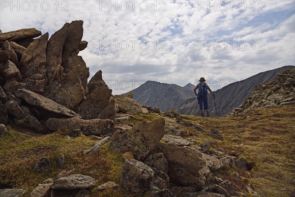 Woman looking at view while hiking in Loveland Pass, Colorado