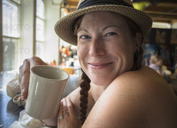 Woman drinking from coffee cup