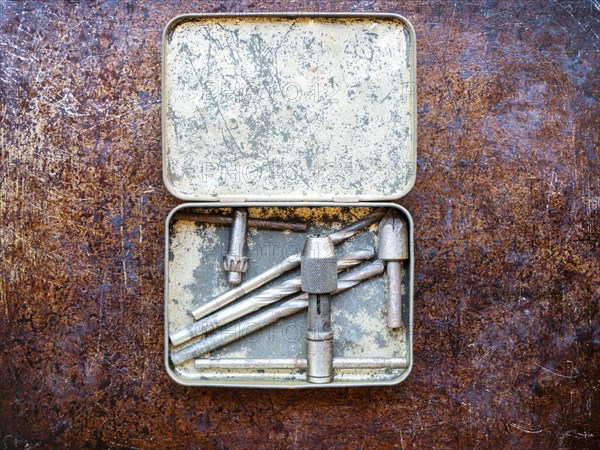 Drill bits in metal box