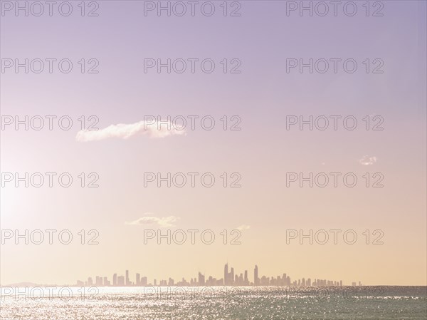 Cityscape and sea at sunset