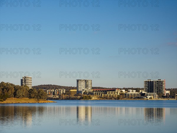 Buildings by lake in Ginninderra, Australia