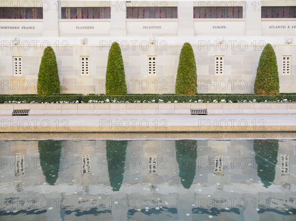 Topiary by reflecting pool at Australian War Memorial in Canberra, Australia