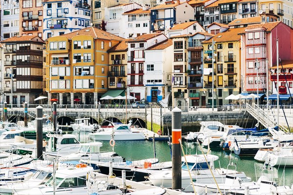 Moored boats and buildings on the waterfront of Bermeo, Spain