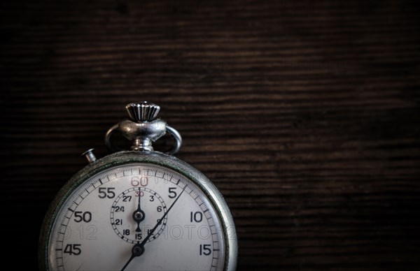 Antique pocketwatch on wooden table